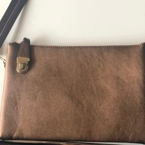 Bronze metallic clutch with locking zipper. new